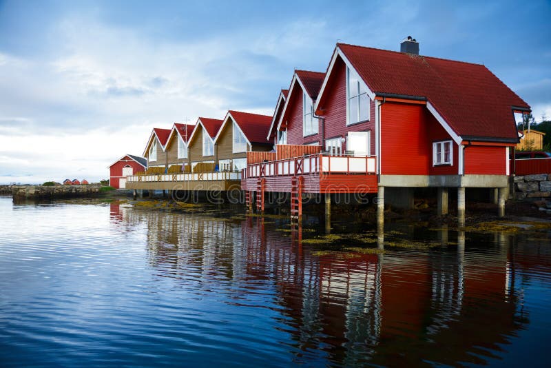 Red wooden cabins at campsite by the fjord in Molde, Norway. Red wooden cabins at campsite by the fjord in Molde, Norway