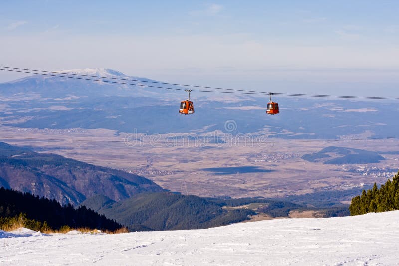 Cable car ski lift over mountain landscape