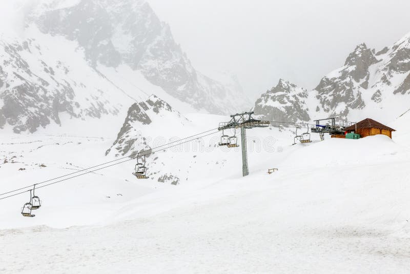 Cable Car in the Snowy Mountains in Cloudy Weather Stock Image Image