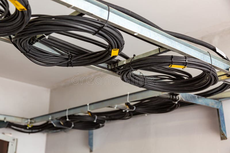 https://thumbs.dreamstime.com/b/cable-management-working-wires-black-cables-wound-coil-circle-rings-coiled-wire-roll-ladder-ceiling-horizontal-193650851.jpg