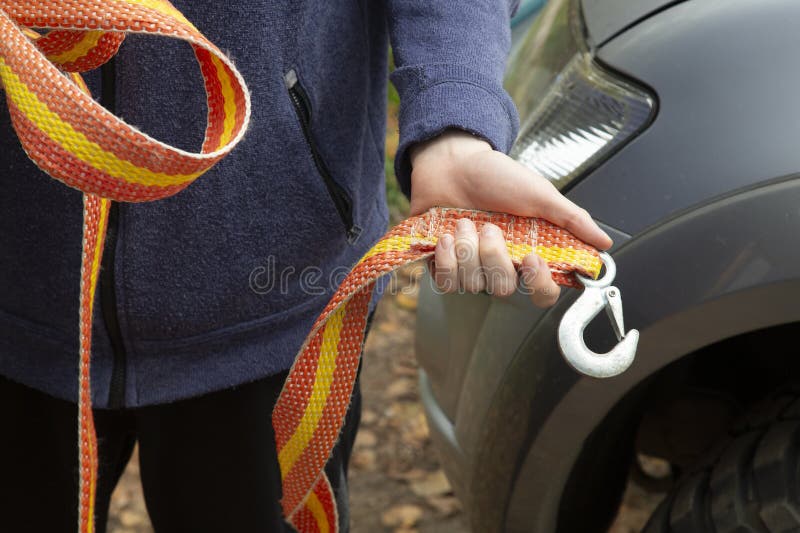 A cable for pulling a stuck car and towing a car stock images