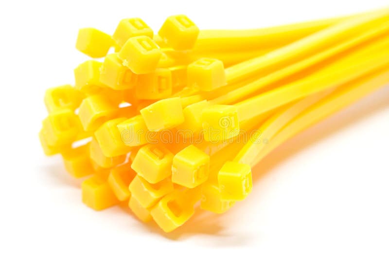 Cable tie in yellow isolated on white background Closeup royalty free stock images Cable tie in yellow isolated on white background Closeup royalty free stock images