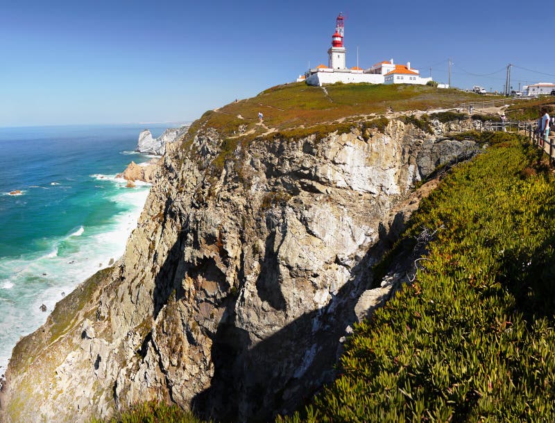 The Cabo da Roca lighthouse on high cliffs - Atlantic Ocean. Cape Rock. Lisbon Portugal. The Cabo da Roca lighthouse on high cliffs - Atlantic Ocean. Cape Rock. Lisbon Portugal