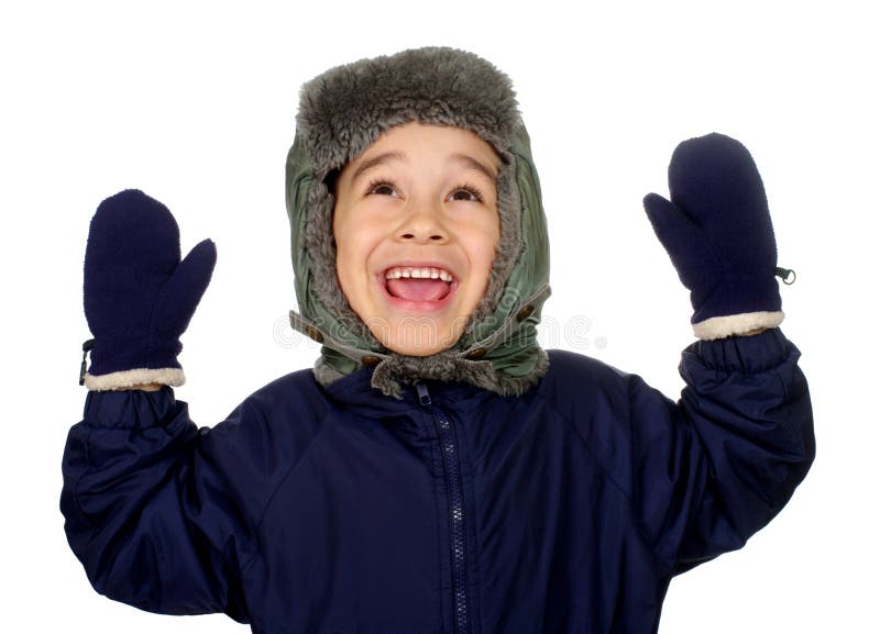 Kid in winter clothes looking up happy, smiling, with hands raised, seven years old, isolated on pure white background. Kid in winter clothes looking up happy, smiling, with hands raised, seven years old, isolated on pure white background