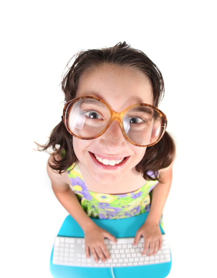 Nerdy Kid Using Computer Looking Up Smiling. Fisheye Lens Effect. Nerdy Kid Using Computer Looking Up Smiling. Fisheye Lens Effect