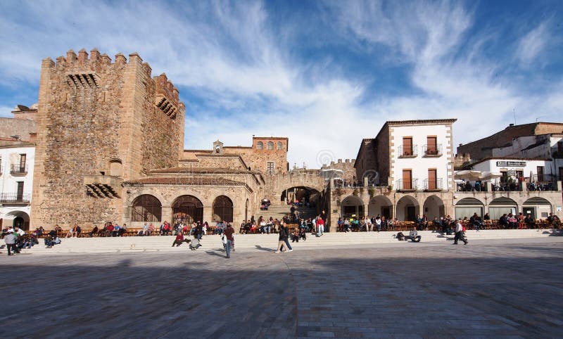 CACERES, SPAIN - APRIL 23: Locals and tourist enjoying a sunny day and waiting for the start of the holy week processions on April 24, 2011 in the main square of Caceres (Spain). Week processions stock images, royalty-free photos and pictures