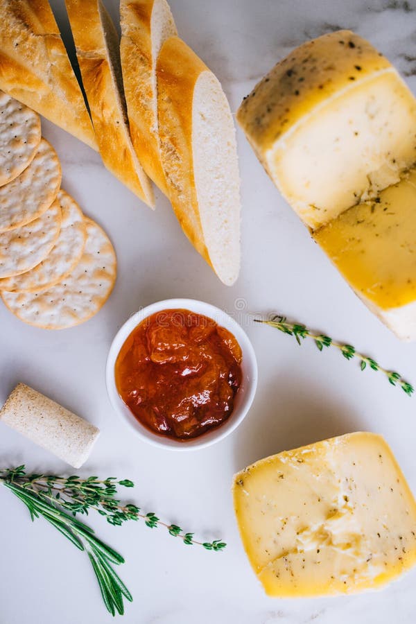 Cachotta Cheese with Herbs, Jam, Baguette, Crackers, Rosemary an Stock