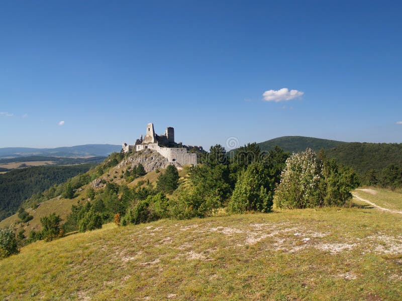 Cachtice castle on hill in distance