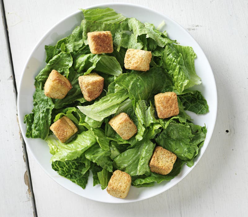 Caesar salad shot from top down view stock images