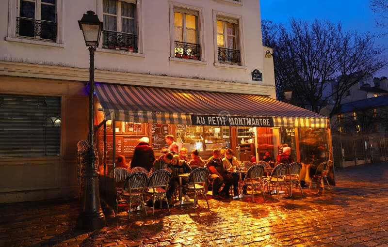 The Cafe Au Petit Montmartre is a Cafe in the Montmartre at Rainy Night ...