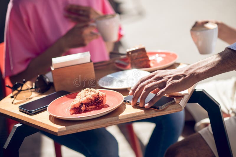 Close Up of Two People Having Coffee at the Cafe Stock Image Image of