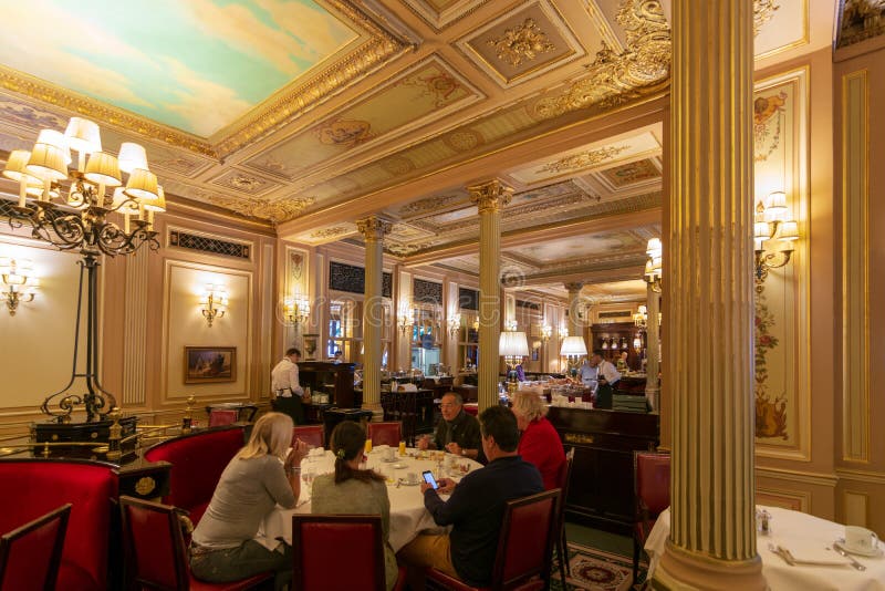 PARIS - SEPT 24, 2018: World famous historical Cafe de la Paix (Cafe of Peace) at the Intercontinental Le Grand Hotel, Paris. PARIS - SEPT 24, 2018: World famous historical Cafe de la Paix (Cafe of Peace) at the Intercontinental Le Grand Hotel, Paris