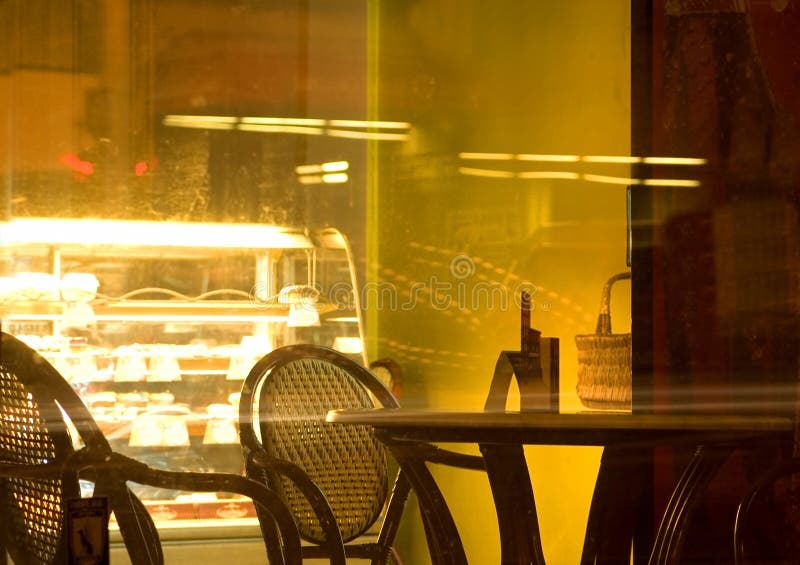 Cafe at night. Empty cafe at night, through the window Cafe at night. Empty cafe at night, through the window