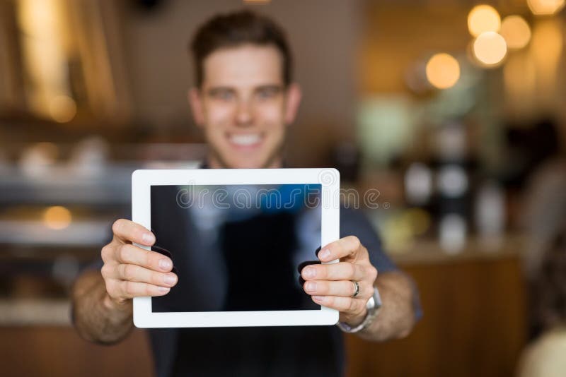 Cafe Owner Showing Digital Tablet stock images Cafe Owner Showing Digital Tablet stock images