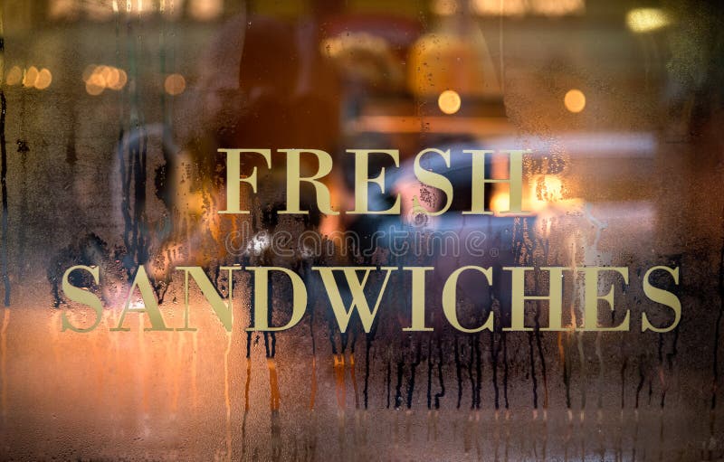 Sign of Fresh Sandwich displayed on cafe window. Window color reflection background stock images, royalty-free photos and pictures