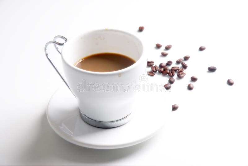 White Cup of Coffee and Toasted coffee beans. White Cup of Coffee and Toasted coffee beans