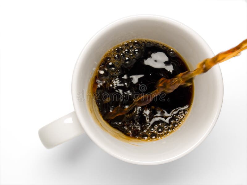 Fresh coffee being poured into a coffee cup on a white background. Fresh coffee being poured into a coffee cup on a white background.
