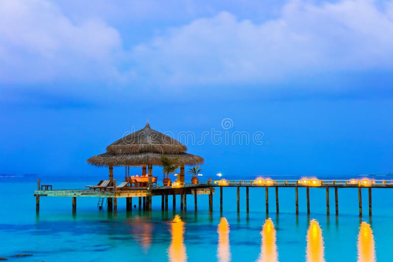 Water cafe at evening - lights, ocean and sky. Water cafe at evening - lights, ocean and sky