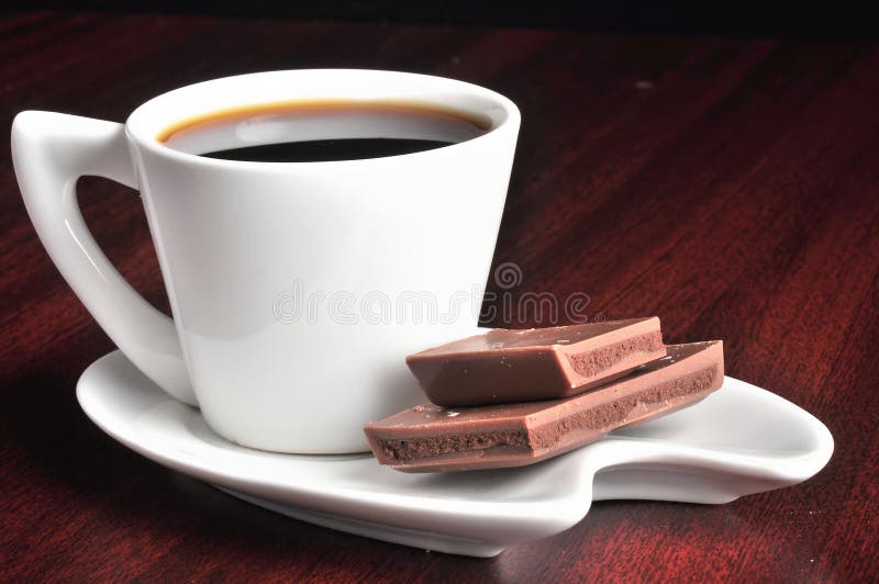 Coffee cup with coffee and chocolates. Coffee cup with coffee and chocolates