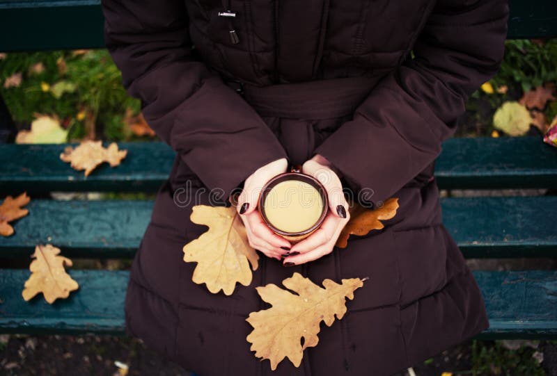 yellow leaves and cup of coffee on the bench with title Hello autumn, fall, background, wooden, hot, table, leaf, food, warm, maple, drink, brown, life, mug, cafe, morning, breakfast, beverage, chocolate, still, vintage, park, nature, cocoa, milk, rest, calm, forest, sunday. yellow leaves and cup of coffee on the bench with title Hello autumn, fall, background, wooden, hot, table, leaf, food, warm, maple, drink, brown, life, mug, cafe, morning, breakfast, beverage, chocolate, still, vintage, park, nature, cocoa, milk, rest, calm, forest, sunday