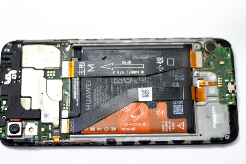 Cairo, Egypt, August 3 2023: Huawei Smartphone cellular mobile device with motherboard electronic chip, camera and SIM card lay royalty free stock image