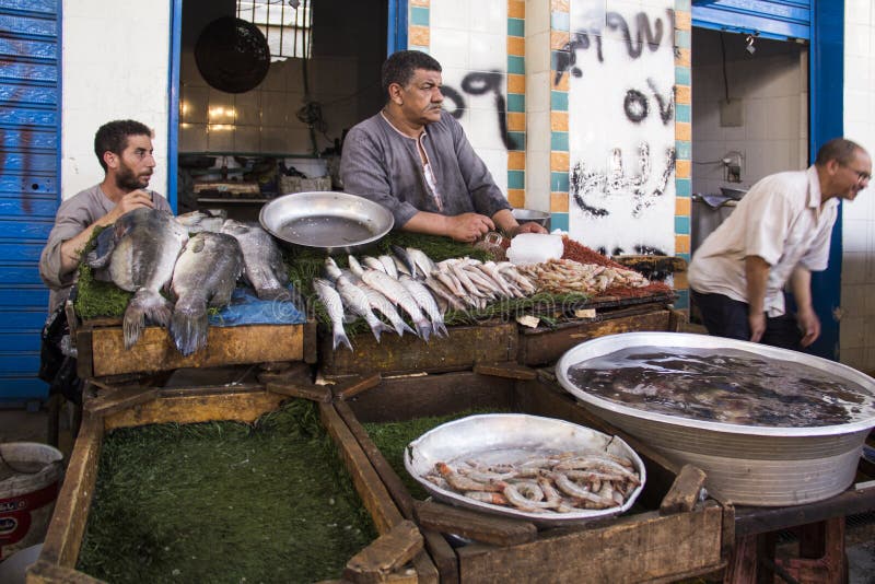 CAIRO, EGYPT DECEMBER 29, 2021 Seller at the Central Fish Market in Cairo Editorial Photo