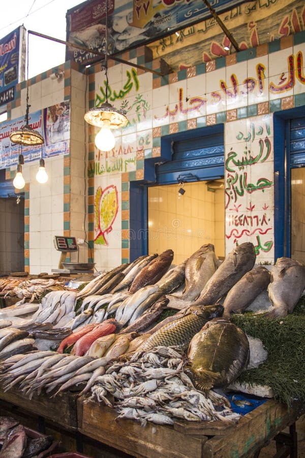 CAIRO, EGYPT DECEMBER 29, 2021 Seller at the Central Fish Market in Cairo Editorial