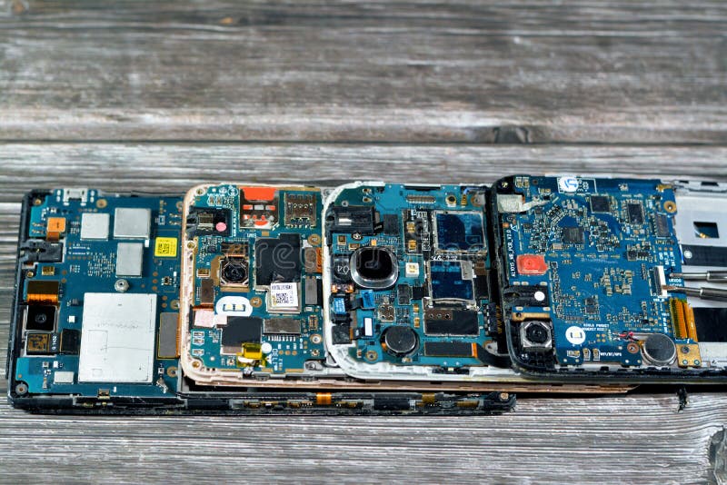 Cairo, Egypt, November 9 2022: Smartphone cellular mobile devices from inside with motherboard electronic chip, camera and SIM stock photos