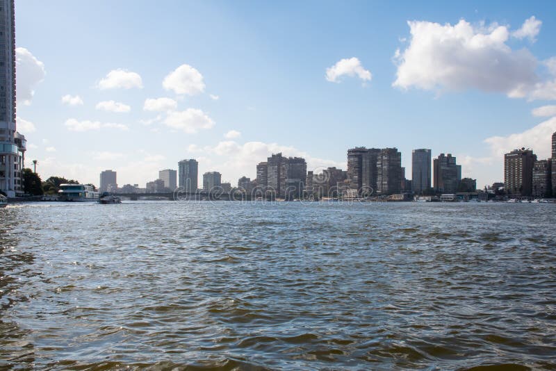 Cairo, Egypt, 24th of December 2018: Cairo river cruise view of the office buildings shore of Nile stock photos Cairo, Egypt, 24th of December 2018: Cairo river cruise view of the office buildings shore of Nile stock photos