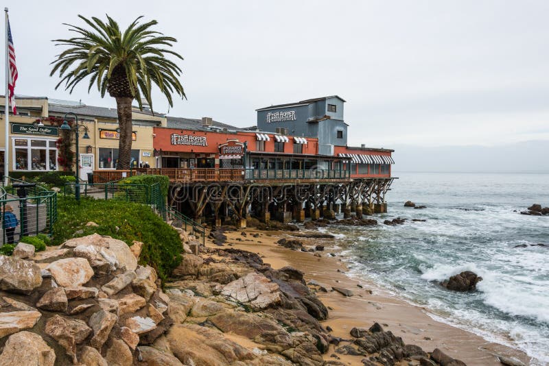 MONTEREY, CA - DEC 17, 2014: Historic 700 Cannery Row pier and beach, Monterey, California. MONTEREY, CA - DEC 17, 2014: Historic 700 Cannery Row pier and beach, Monterey, California.