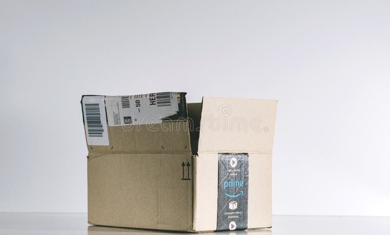 PARIS, FRANCE - JUL 30, 2017: Open Amazon Prime cardboard box side. Amazon is an American electronic e-commerce company distribution worlwide e-commerce goods. PARIS, FRANCE - JUL 30, 2017: Open Amazon Prime cardboard box side. Amazon is an American electronic e-commerce company distribution worlwide e-commerce goods