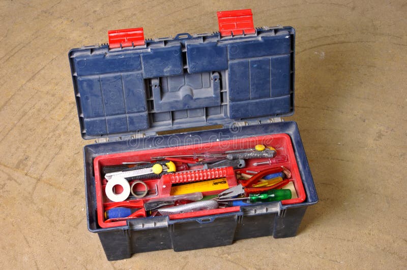 A workman's toolbox on a stripped floor, during construction work. A workman's toolbox on a stripped floor, during construction work.