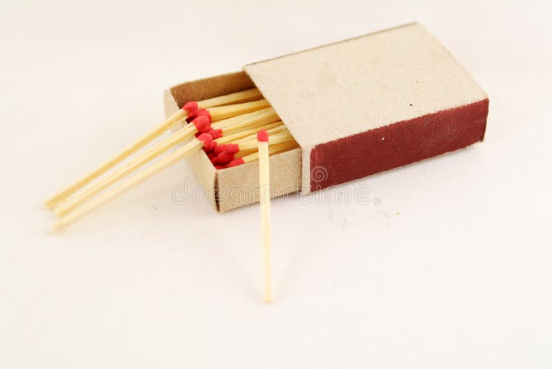 Matchbox and four matches around. Matchbox and four matches around