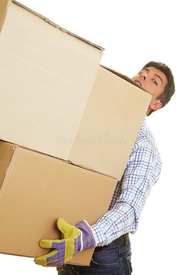 Man carrying three huge cardboard boxes. Man carrying three huge cardboard boxes