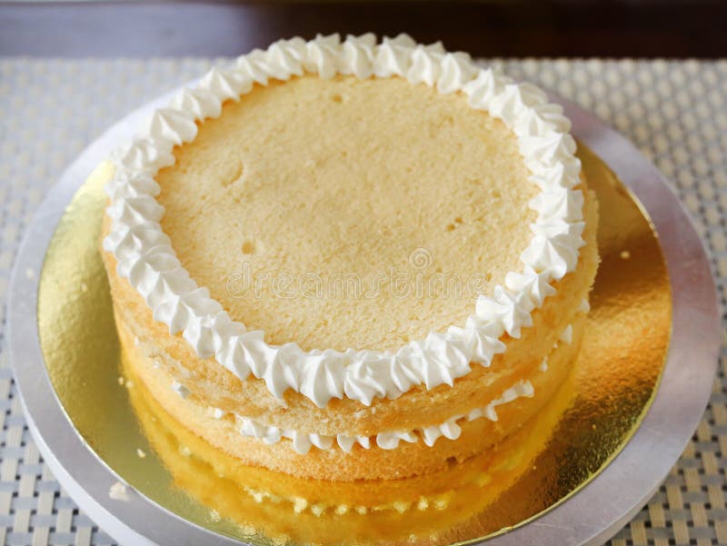 Cake in Process on Stand on Wooden Table, Homemade Cake Stock Image
