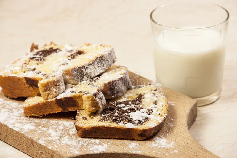 Chestnut cake slices with powder sugar and milk. Chestnut cake slices with powder sugar and milk.