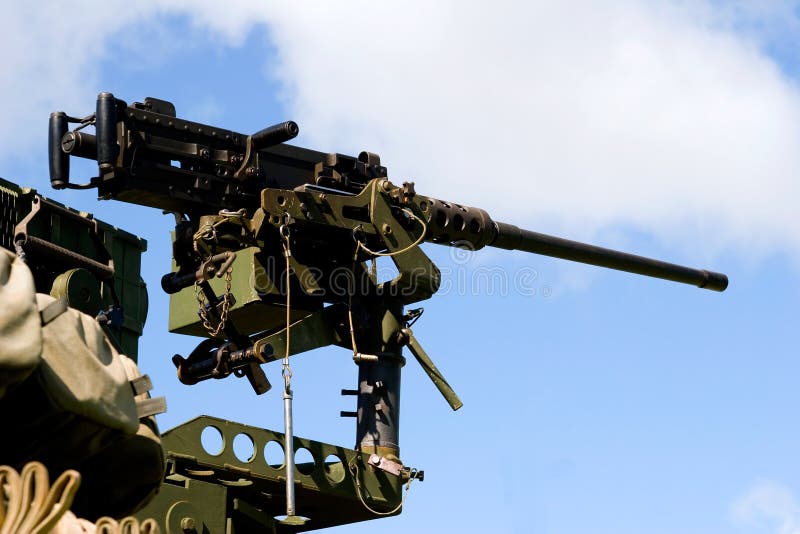 Fifty-cal machine gun standing at the ready position for combat. Fifty-cal machine gun standing at the ready position for combat