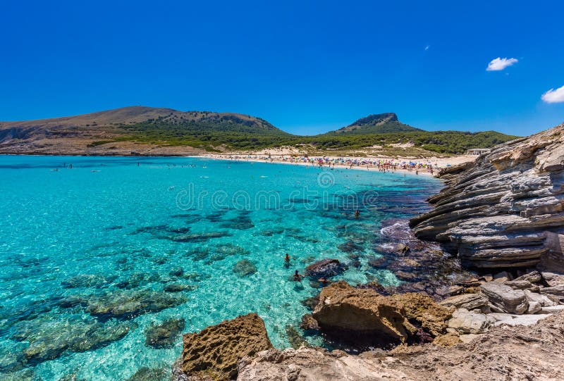CALA MESQUIDA, MALLORCA, SPAIN - 19 July 2020: People enjoying beautiful sandy beach of on Mallorca, Mediterranean Sea, Spain. CALA MESQUIDA, MALLORCA, SPAIN stock images CALA MESQUIDA, MALLORCA, SPAIN - 19 July 2020: People enjoying beautiful sandy beach of on Mallorca, Mediterranean Sea, Spain. CALA MESQUIDA, MALLORCA, SPAIN stock images