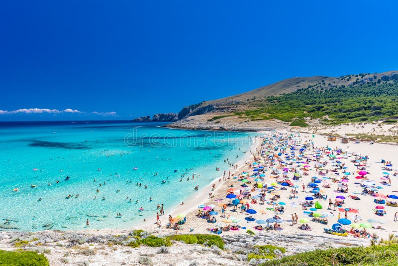 CALA MESQUIDA, MALLORCA, SPAIN - 19 July 2020: People enjoying beautiful sandy beach of on Mallorca, Mediterranean Sea, Spain. CALA MESQUIDA, MALLORCA, SPAIN stock images CALA MESQUIDA, MALLORCA, SPAIN - 19 July 2020: People enjoying beautiful sandy beach of on Mallorca, Mediterranean Sea, Spain. CALA MESQUIDA, MALLORCA, SPAIN stock images