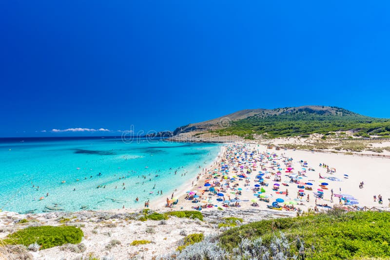 CALA MESQUIDA, MALLORCA, SPAIN - 19 July 2020: People enjoying beautiful sandy beach of on Mallorca, Mediterranean Sea, Spain. CALA MESQUIDA, MALLORCA, SPAIN royalty free stock images CALA MESQUIDA, MALLORCA, SPAIN - 19 July 2020: People enjoying beautiful sandy beach of on Mallorca, Mediterranean Sea, Spain. CALA MESQUIDA, MALLORCA, SPAIN royalty free stock images