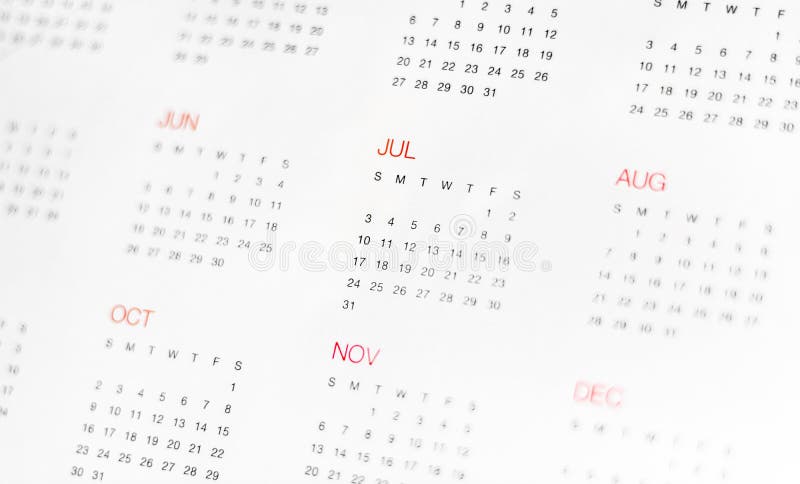 A calander with the months written in red and the days in black. A calander with the months written in red and the days in black.