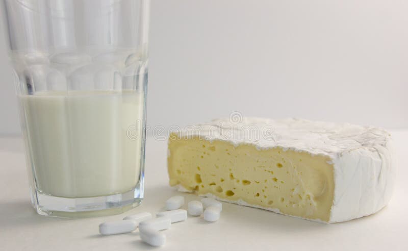 Calcium supplement with glass of milk and cheese. Calcium supplement with glass of milk and cheese