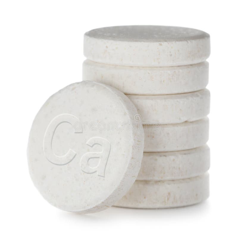 Calcium supplement. Stack of tablets on white background, closeup