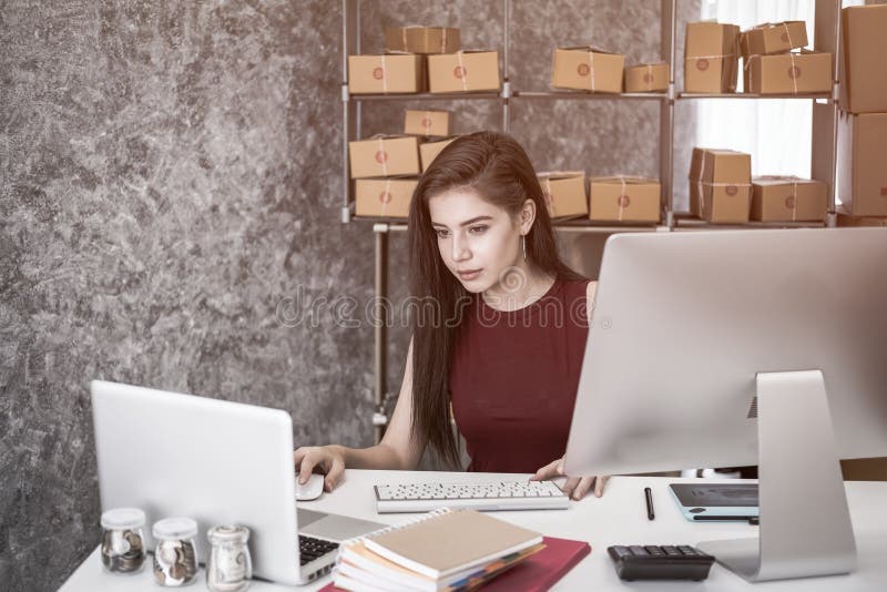 Calculating The Cost Of Postage Of A Small Package, Stock Photo Image