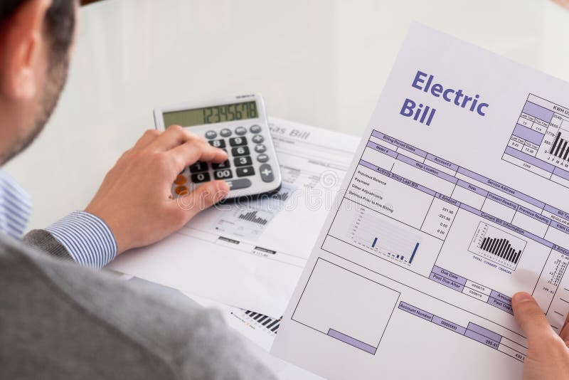 Calculating energy efficiency and energy bill papers royalty free stock images Calculating energy efficiency and energy bill papers royalty free stock images