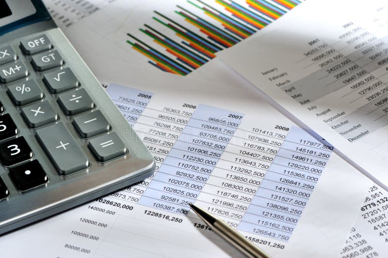 The calculator and the financial report stock images