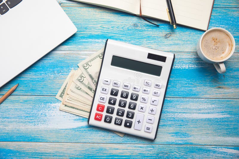 Calculator, money, notebook, notepad and coffee stock photo