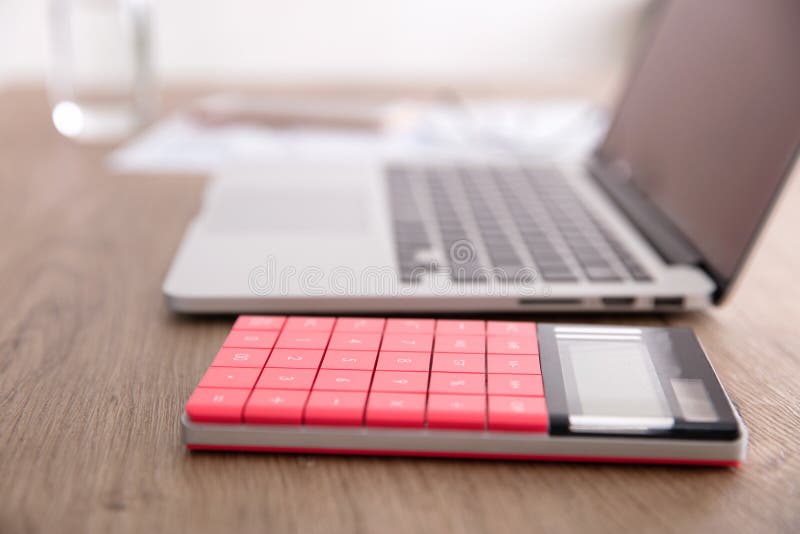 Laptop and Calculator and a Cup of Coffee Editorial Photography Image