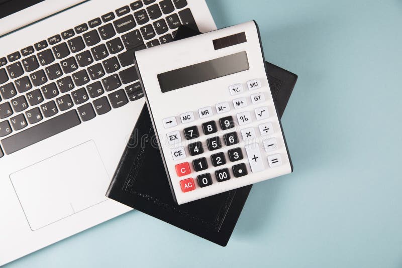 Calculator, notepad and notebook stock photo