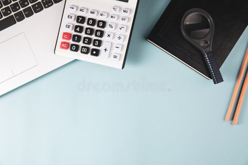 Calculator, notepad, magnifier and notebook royalty free stock photos